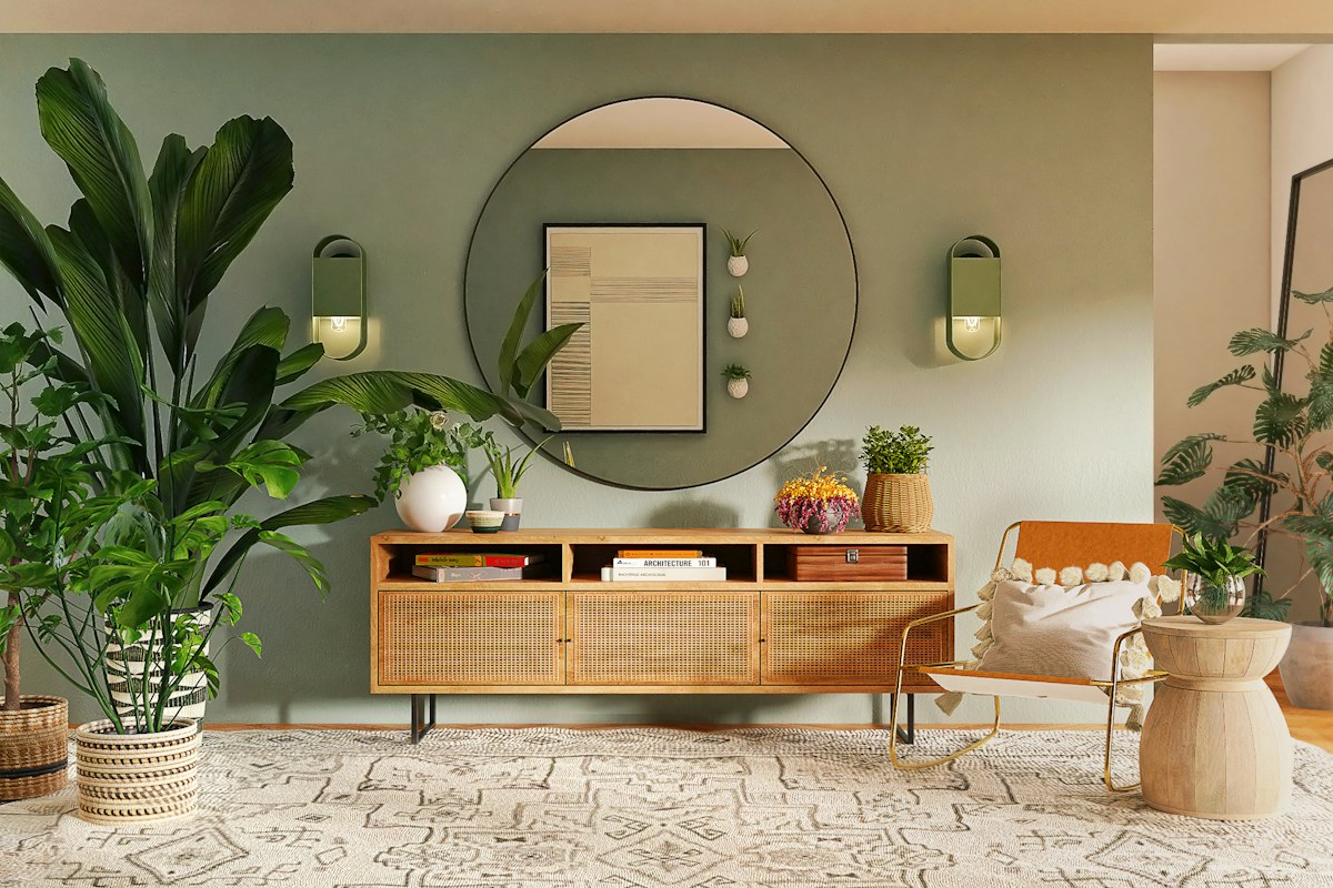 Dining room with a wooden sideboard, round mirror and indoor plants